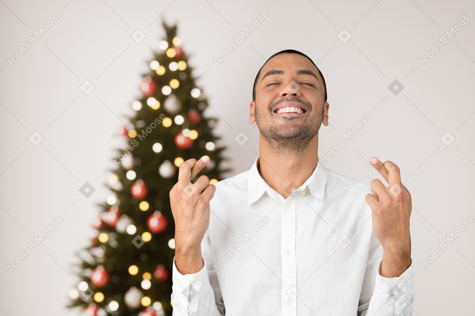 Young man wishing his dreams come true at christmas