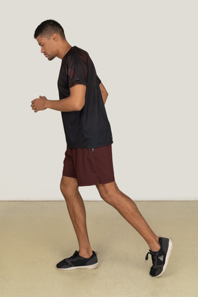 Young man in sports clothes jogging