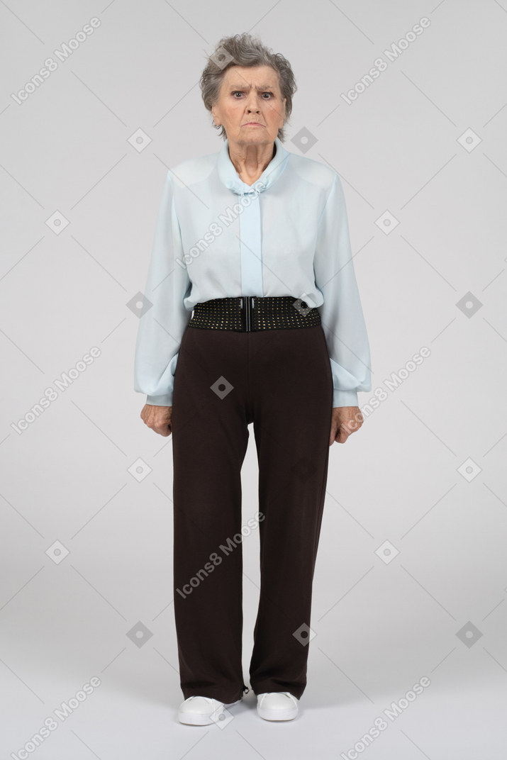 Front view of an old woman frowning intensely