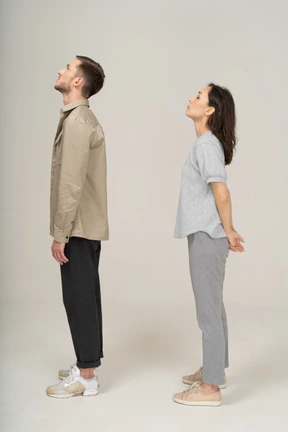 Young couple looking up