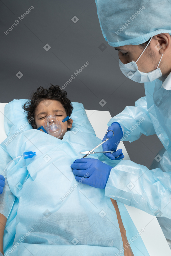 Doctor is operating on boy