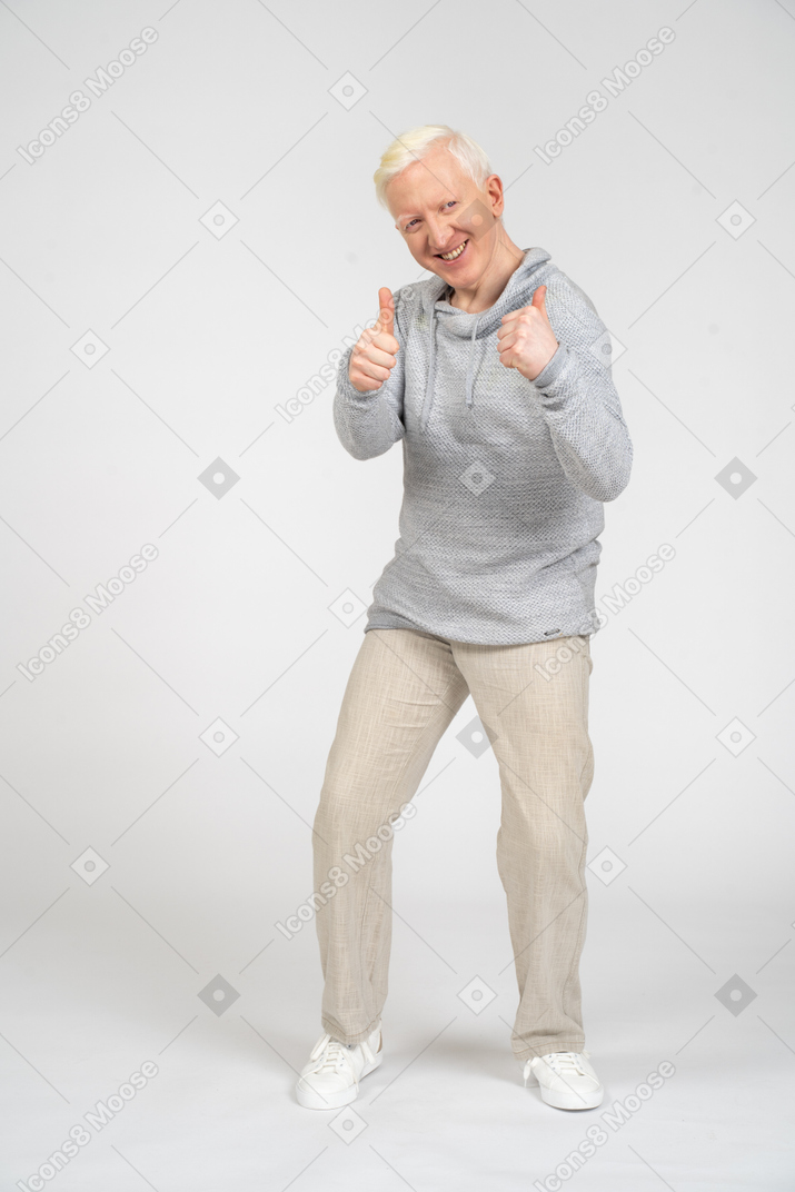 Man smiling and giving thumbs up