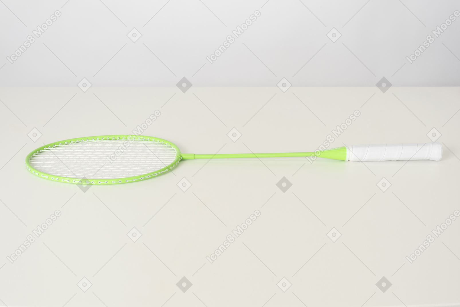 Green tennis racket on a white background