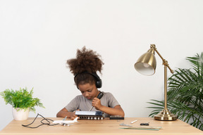 Cute girl trying to repair an device