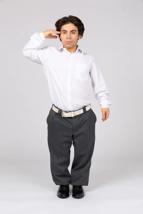 Male office worker giving a salute