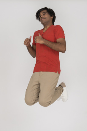 Young man jumping in air