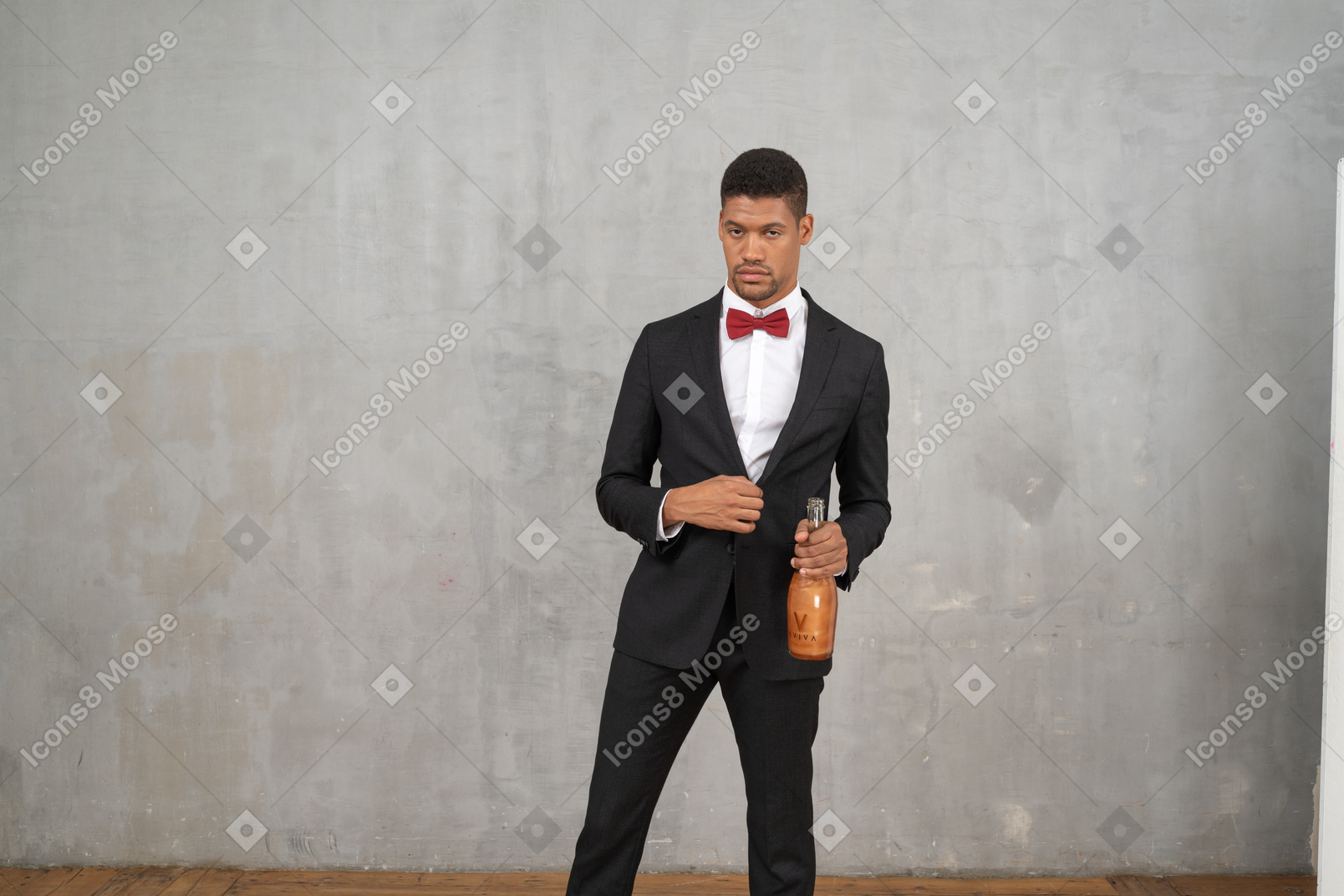 Tipsy man standing with a champagne bottle