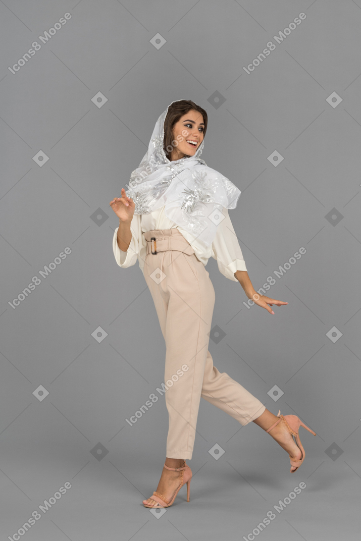 Cheerful arab woman is about to dance