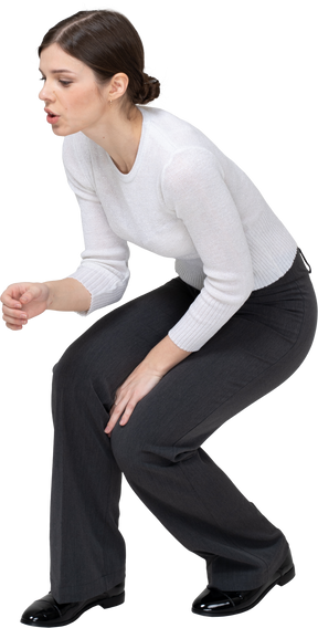 Front view of a woman squatting