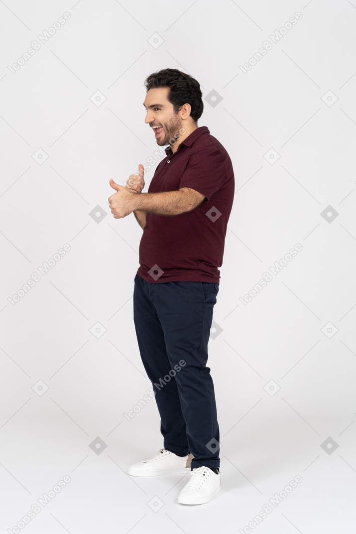 Cheerful man showing thumbs up