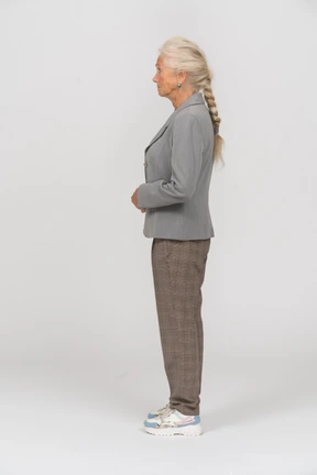 Old woman in suit posing in profile