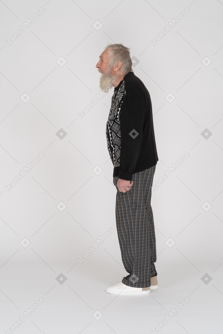 Side view of an old man standing with mouth open