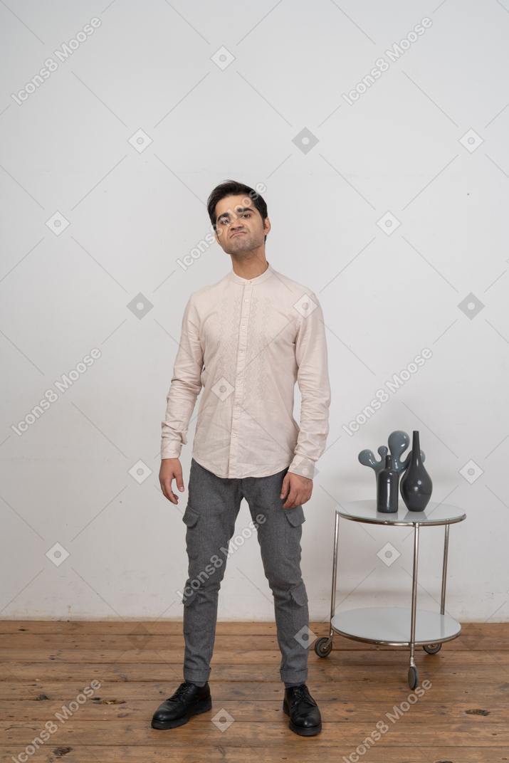 Front view of an angry man in casual clothes