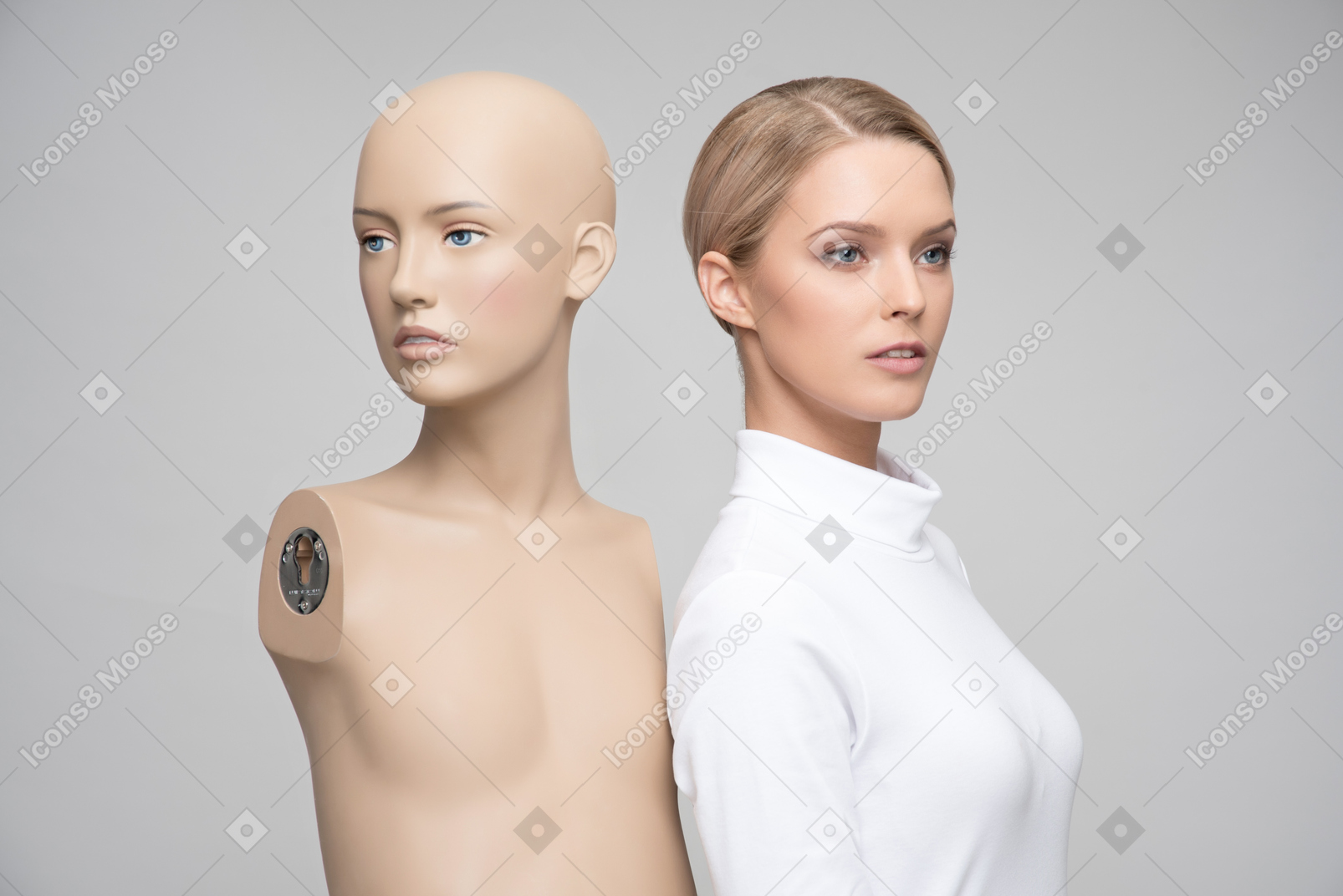 Beautiful young blonde woman and mannequin