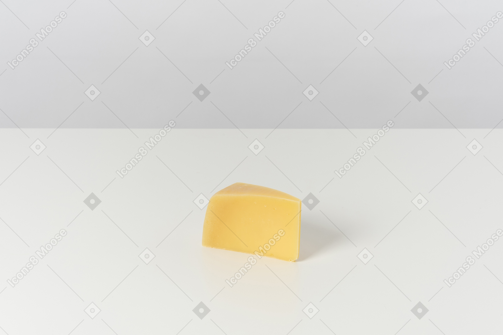 Piece of cheese on grey background