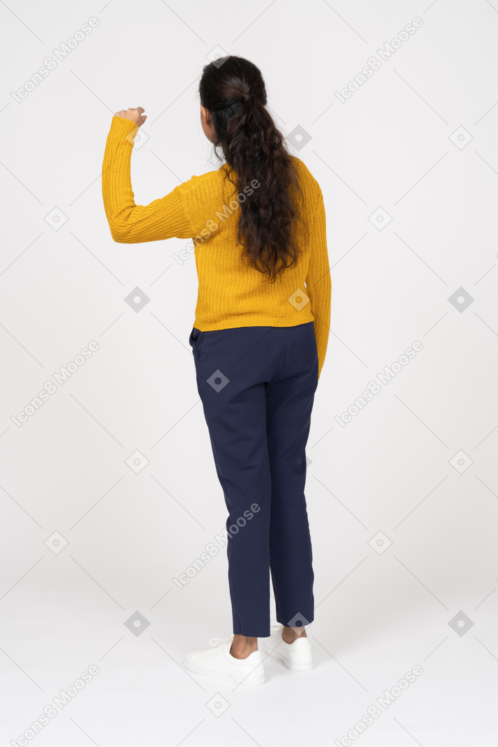 Rear view of a girl in casual clothes showing the size of something