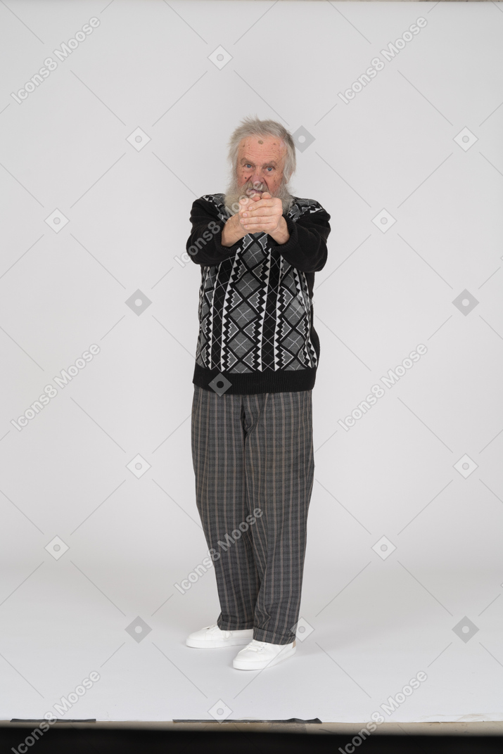 Old man with finger gun aiming