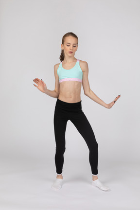 Full-length of a teen girl in sportswear dancing