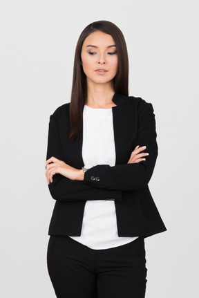 Business woman standing with folded arms