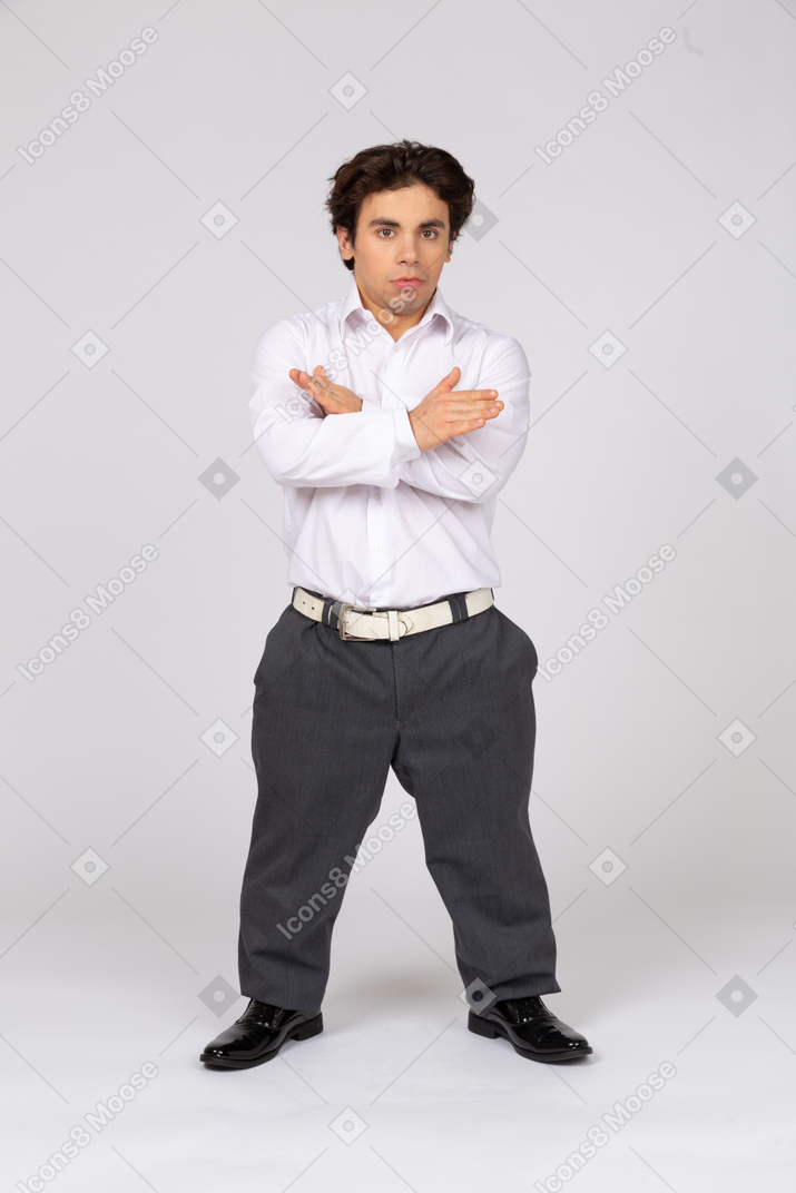 Man showing stop gesture with crossed hands