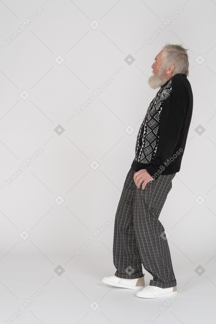 Profile view of a scared elderly man leaning back