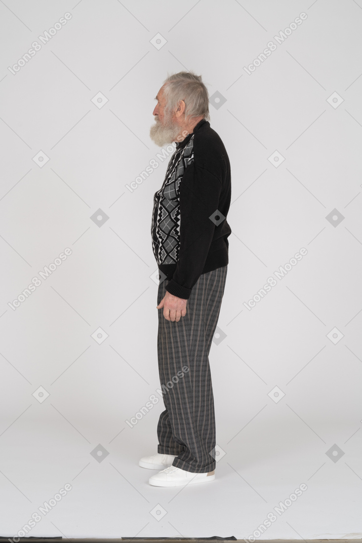 Side view of elderly man standing still