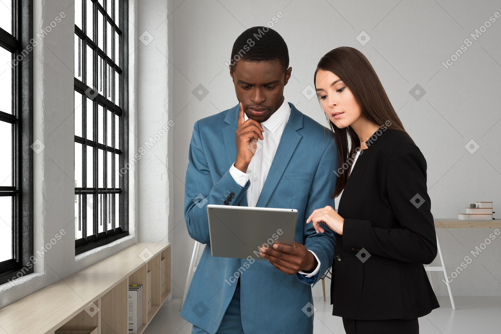 A man and a woman talking in an office