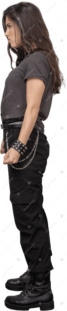 Side view of a female rocker clenching fists for self defense