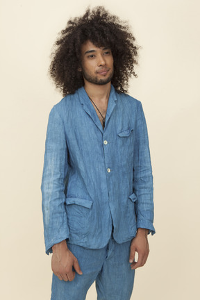 Afroman with big curly hair wearing denim suit