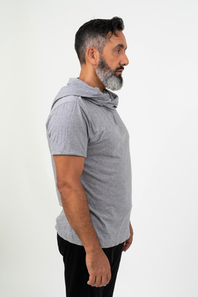 Mature man standing in profile