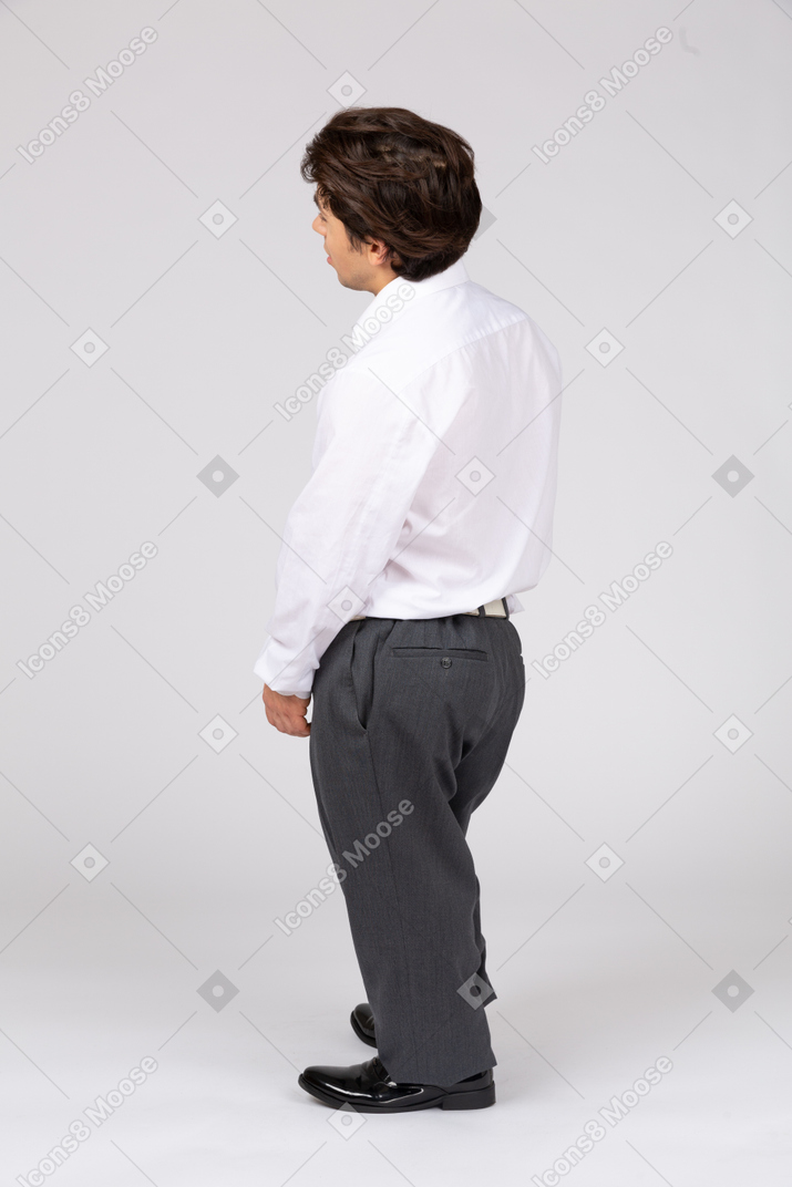 Back view of male white collar worker looking away