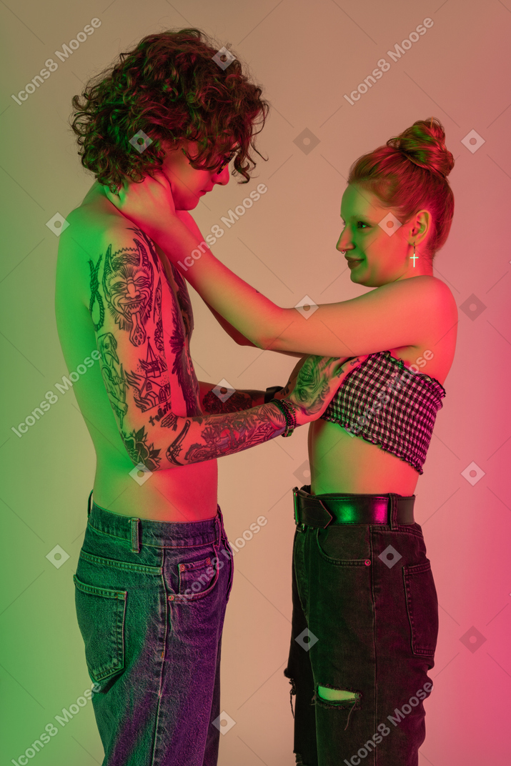 Teen couple in casual clothing standing next to each other