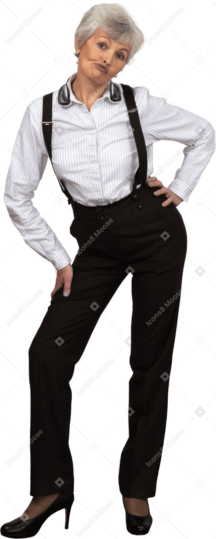 Front view of an old naughty female in office clothes bending down and grimacing putting hands on hips
