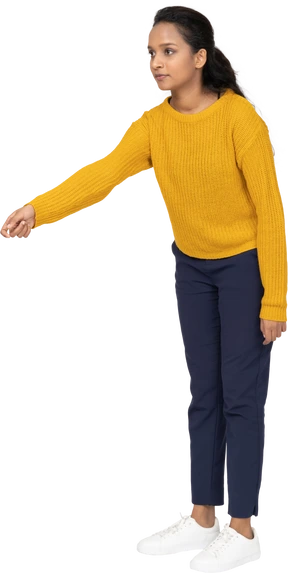 Front view of a girl in casual clothes pointing with arm