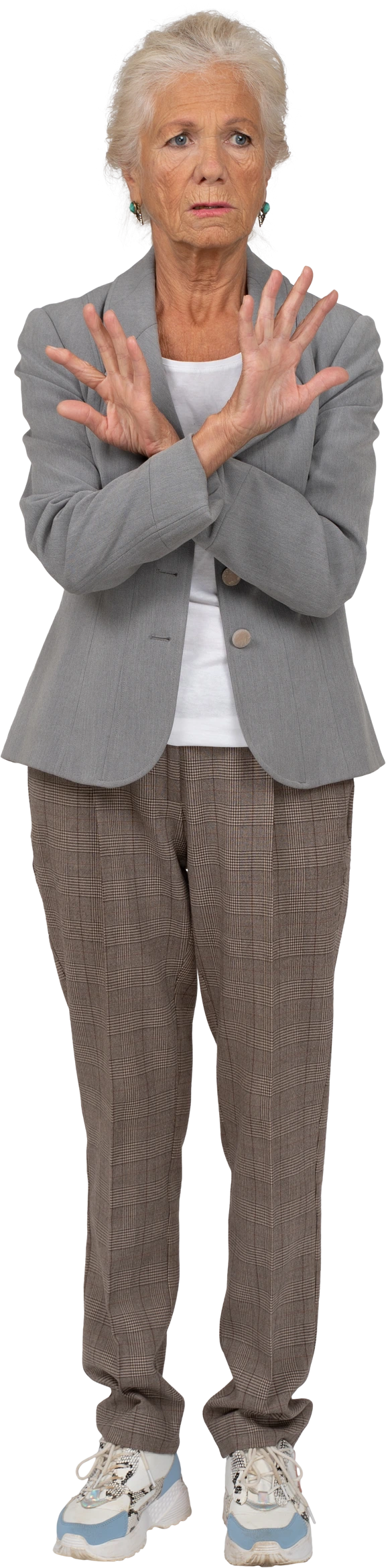 Front view of an angry old lady in suit showing warning gesture Photo