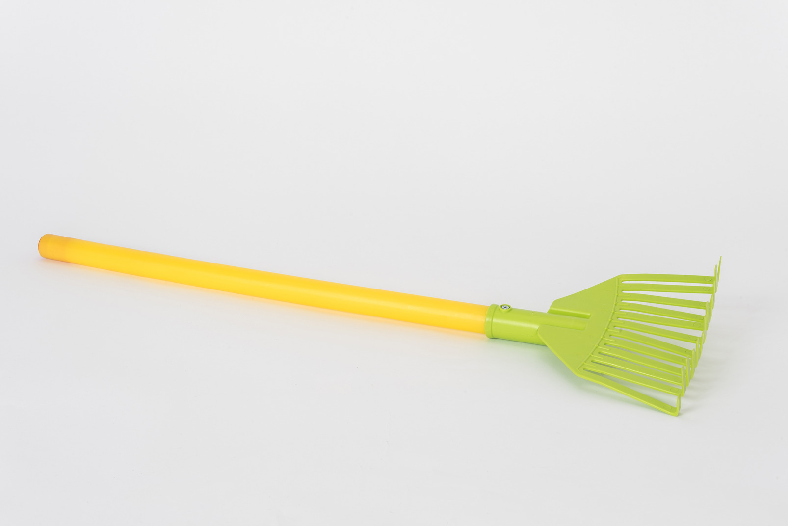 Colorful leaf broom on a white background