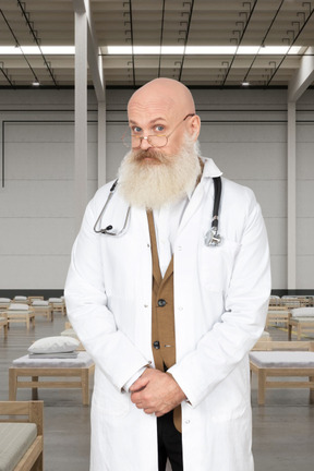 A man with a beard wearing a lab coat