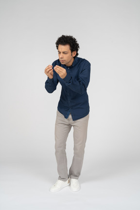 Front view of a man in casual clothes gesturing