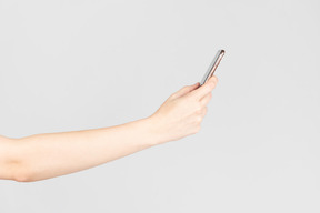Female hands holding smartphone
