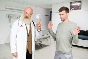 Doctor scolding patient
