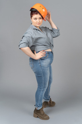 Young woman trying on safety helmet