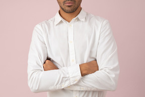 Cropped photo of a young man in a white shirt