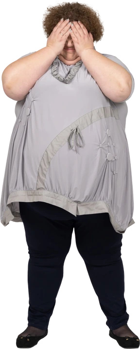 Side view of a woman covering her face