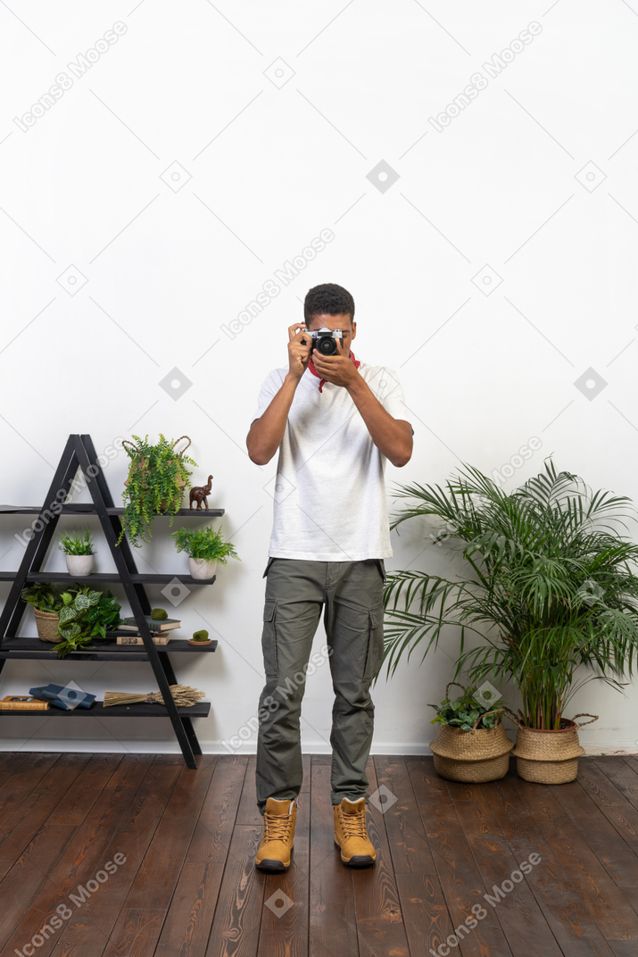 Good looking young man with a camera
