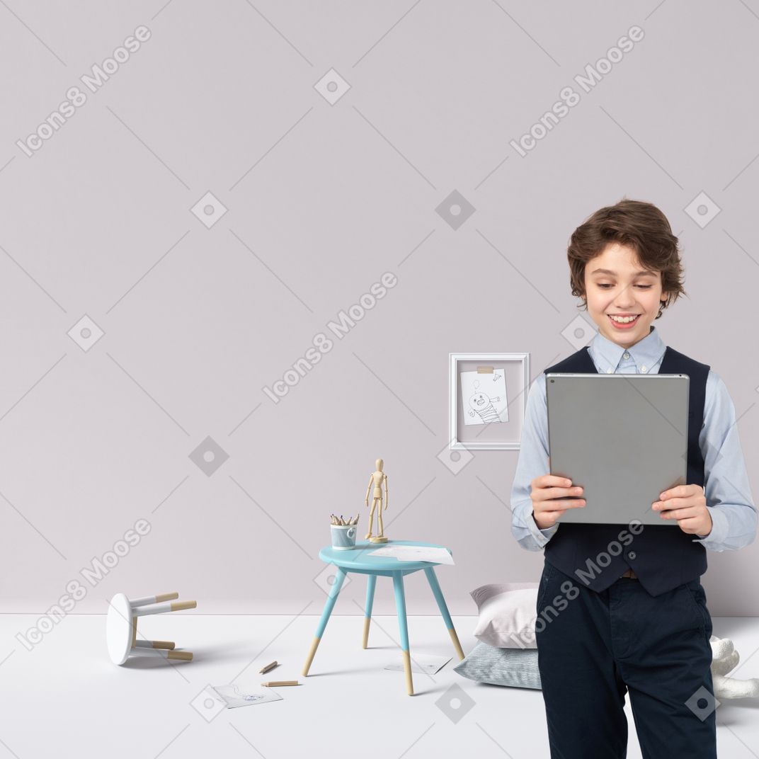 A boy in a school uniform holding a tablet