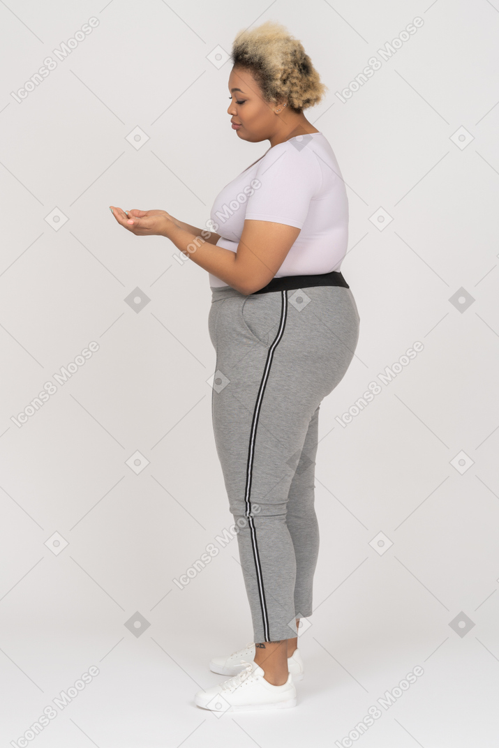 Body positive african-american female holding palms together