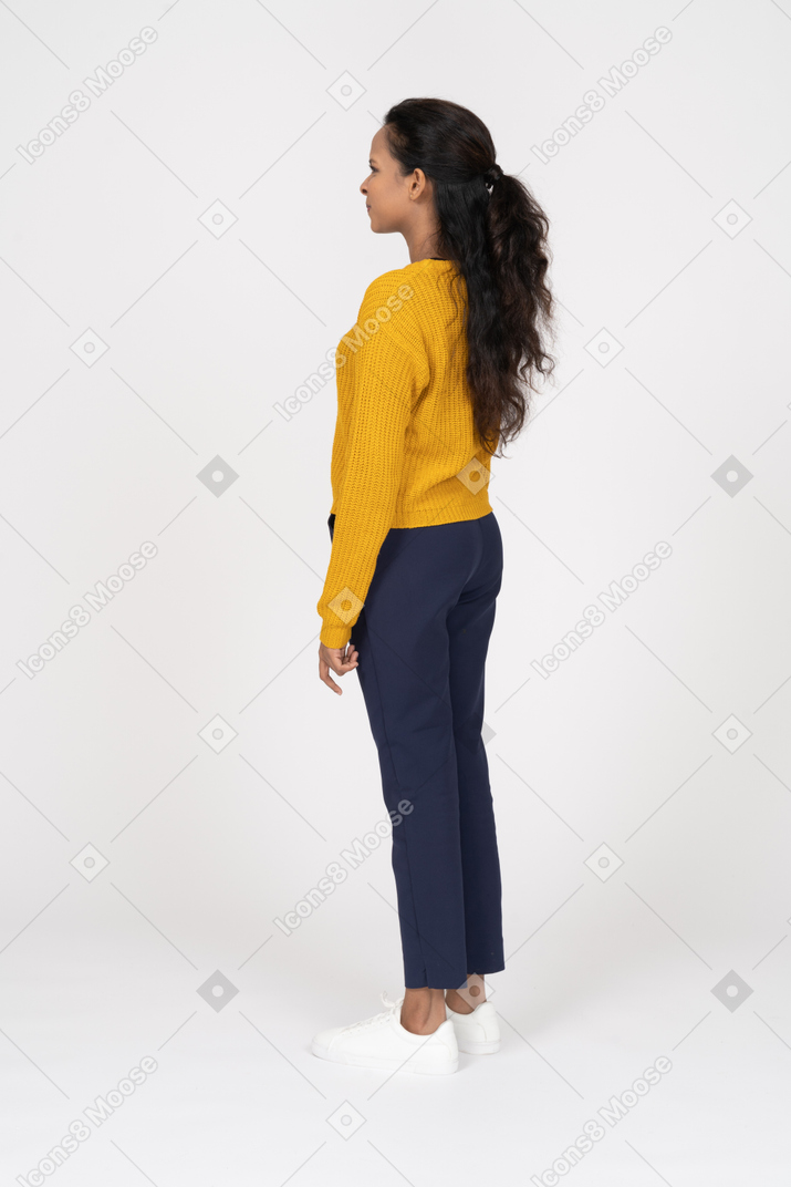 Girl in casual clothes standing in profile