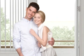 A man and a woman standing next to each other