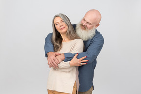 Elegant senior couple standing together