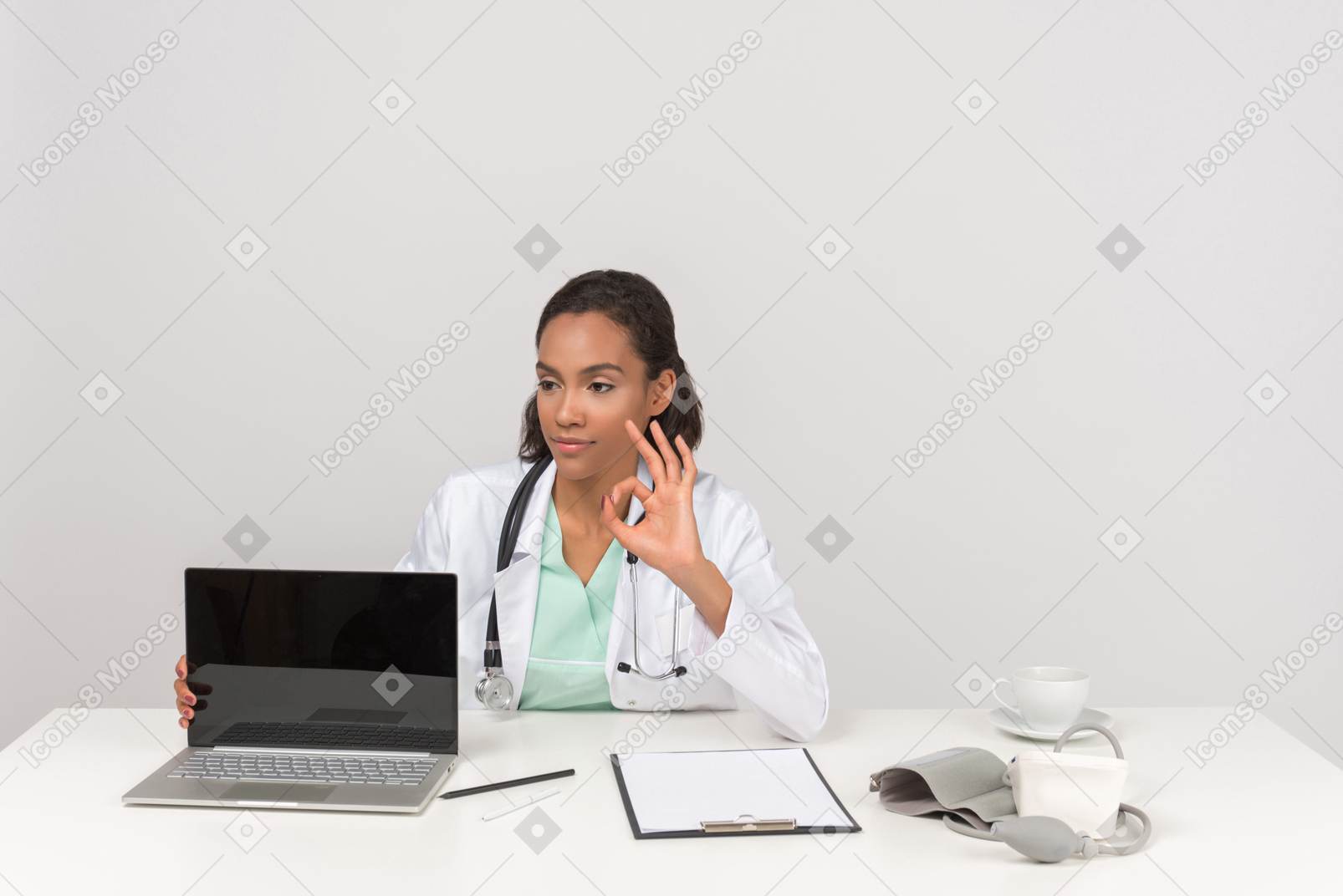 Female doctor showing ok gesture